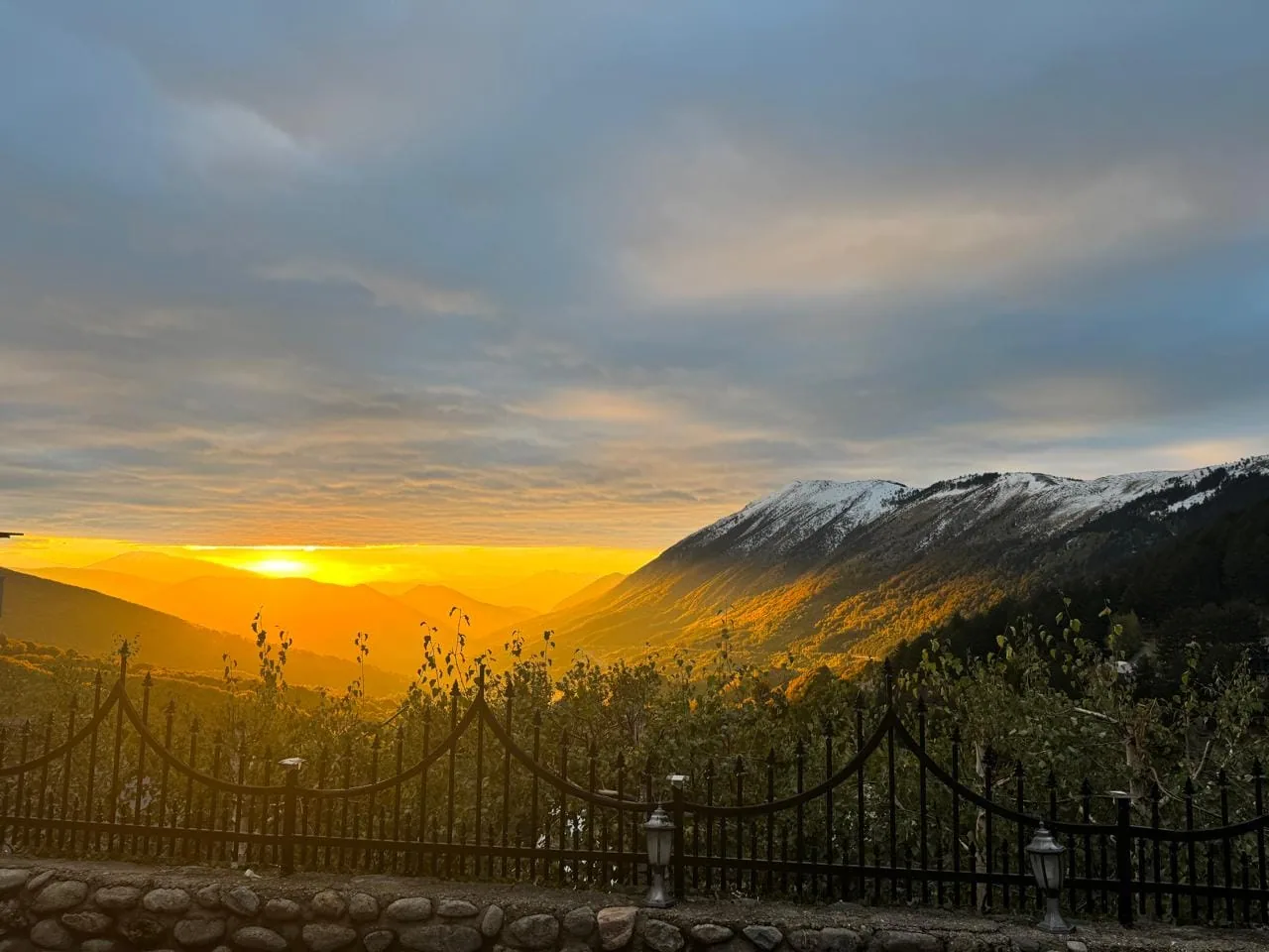 Sunset over the mountain ridge seen from Villa Bjeshka in Prevallë