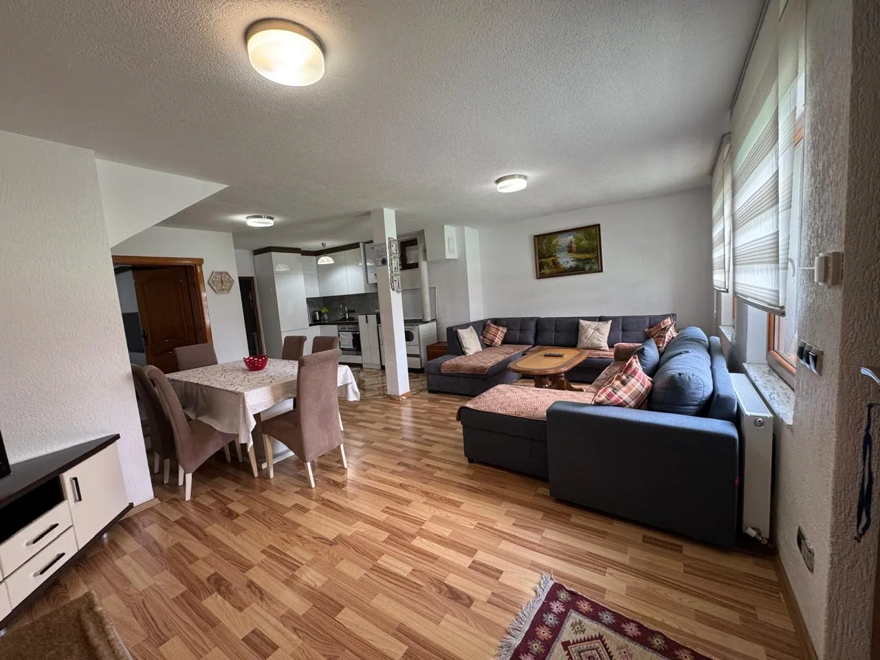 Living and dining area of Apartment 1 at Villa Bjeshka