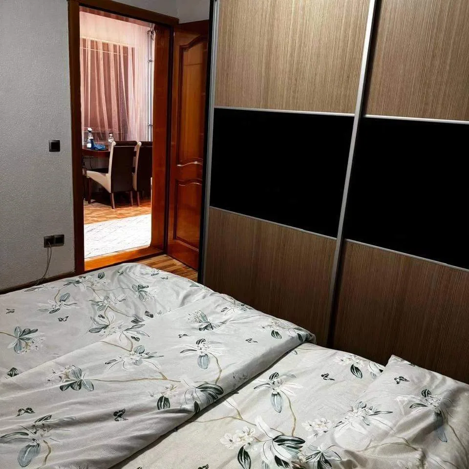 Bedroom with wardrobe in Apartment 2