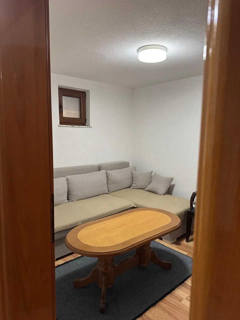 Living area with sofa and coffee table in Apartment 3