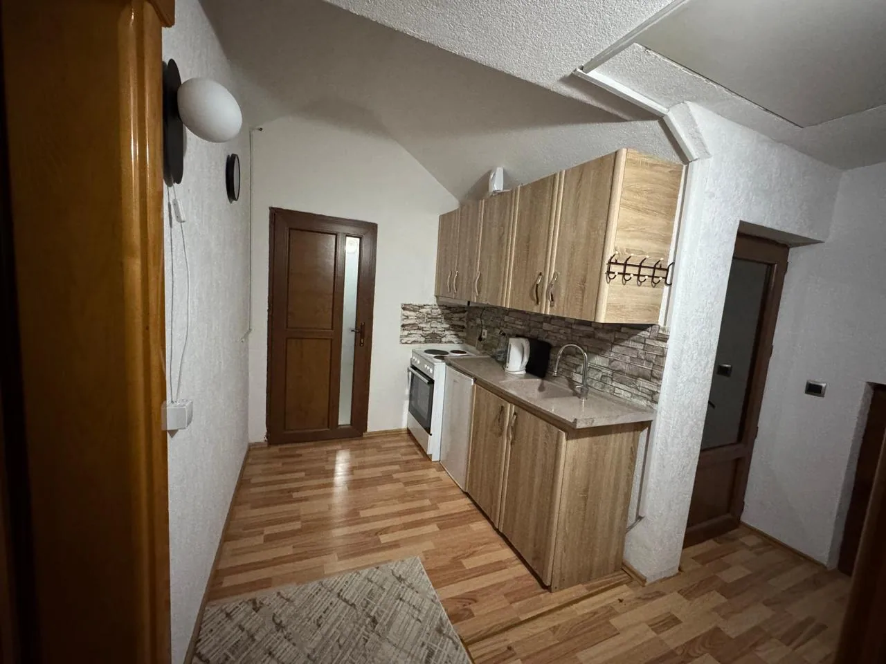 Kitchen and hallway of Apartment 3
