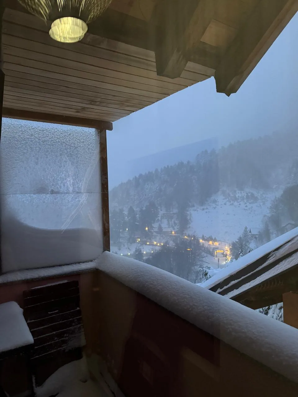 Snow-covered balcony view from Apartment 3